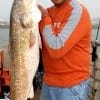 IMG_5529- Iraq Vet Adrian Rodrequez of Killeen TX fishing with his former Marine dad took this BIG 42inch- 27lb red on squid-