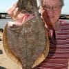 IMG_5616- ready for the pan- this 18inch flounder is held up for her husband by Liz Birker of Canada-