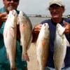 Randy West and Fishing bud show off their stringer of specks and reds