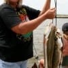 Patti Wilcox of Gilchrist with a heavy stringer of specks and reds-