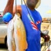 Derald Jackson of Houston tethered these nice reds and specks using live shad.