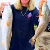 Spring,TX angler Kim Nettles took these big reds on finger mullet.