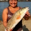 Lilian Adams of Huntsville, TX caught this nice red on finger mullet.