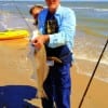 Lufkin angler Barry Cullbertson surfed to catch and release this bull red.