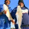 IMG_9569- Fishin pals Nadie Greer and George Latham of Houston buddied up with these two slot reds caught on live shrimp-