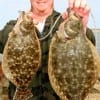 Clayton Davis of Pearland, TX hung these 16 and 20 inch flounder on Berkley Gulp.