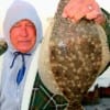 BRRR tiz cold out here sayz Frank Bunyard of Tarkington Prairrie, TX holding his 18 inch flounder caught on Berkley Gulp.