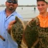 IMG_0234- Dad and stepson- Kyle Royer and Dustin Lereaux of Hampshire TX wde-fished with berkley gulp for these two nice flounder-