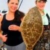 Mom and son- Faith and Chance Black of Spring TX heft mom's 22inch flounder she caught on a miss nancy mud minnow.