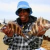 Mary Eagleton of  Crosby TX shows off these two nice sheepshead caught on shrimp.