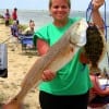 Outfishing the Dudes- Brandy Broadway of  Mount Belview took this 33 inch tagger ed and nice flounder on finger mullet.