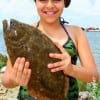 Prissilla Soriano of Houston hefts this nice flounder caught on a finger mullet.