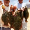 Fishin Bro's James and Henri Fontenot wade-fished rollover bay with berkley gulp to string up this double limit of flounder- including a 26 inch 7.5 lb saddle blanket.