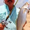 Old River TX angler Louis Rodriguez hefts this 4lb speck caught on a pumpkinseed-chart Saltwater Assassin.