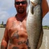 Kevin Bell of Katy TX hefts this 27 inch- 7lb speck caught on a -Chicken on a Chain- Saltwater assasin.