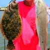 Gilchrist, TX angler Gale LeBlance fished finger mullet for this nice flounder and red.