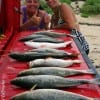 Kim Horton and Sharon Barker show off their husbands night-fishing catch produced by soft plastics.