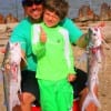 Father and son - Andy Adamez helps 8 yr old Drew with his gafftop he caught on the same line while fishing finger mullet