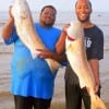 TJ Jolivete and Larry Webster of Missouri City TX waded the surf to catch these two HUGE 40 inch plus tagger bull reds on shrimp