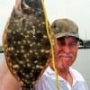 MINE'S BIGGER, stated Charles Rylee of Houston about his and wife's flounder catches