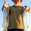 Capt. Jack of Gilchrist TX wrangled up these two 24 inch specks he caught on Lil' Fishies