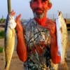 Conroe angler Alton Thorpe hefts two of his 10 trout limit he caught on live shrimp