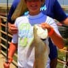 Father and son, Greg and Jon Lock of Temple TX took this nice 24 inch slot red on a shad