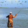 Fly Angler fishing for flounder on Rollover Bay