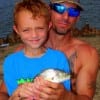 Former Marine Daddy Cero Dwyer of Amarillo TX with junior and his fresh caught croaker