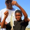 Grandpa and Grandson, James Young helped Anthony Robertson of Houston with his very first trout catch, but ALAS, it was too small so he released it