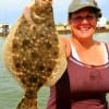 Hefting her first Flounder EVER, Julie Mitchell of Conroe TX nabbed this beauty on a finger mullet