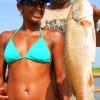 Houston anglers Keon and Nicole Banks caught this 23 inch native slot red on live shrimp