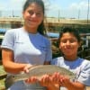 Jennifer and Keven Peralta of Humble TX caught and released this 18 inch rat red. Jennifer took this on a finger mullet