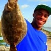 Steven Goudeau of Houston hefts this nice keeper flounder caught on a Berkley Gulp